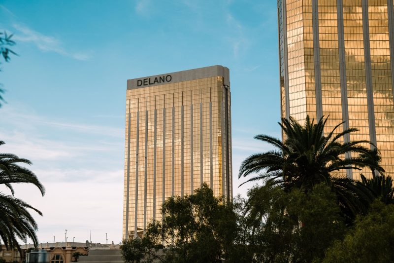 Iconic Delano hotel towers rise under a clear blue sky in Las Vegas.