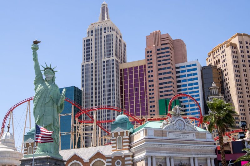 Las Vegas skyline featuring the New York-New York Hotel and a replica of the Statue of Liberty.